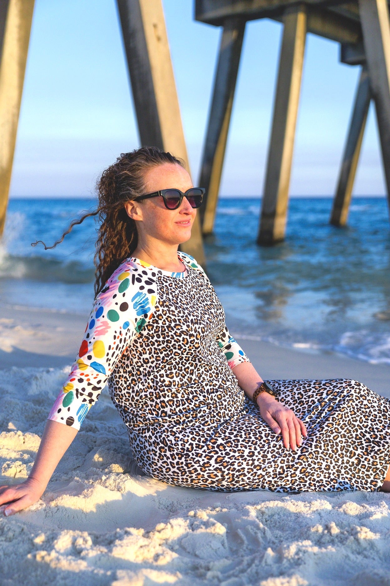 Model wearing Nuggles® Sport Swim Dress in Confetti Leopard
