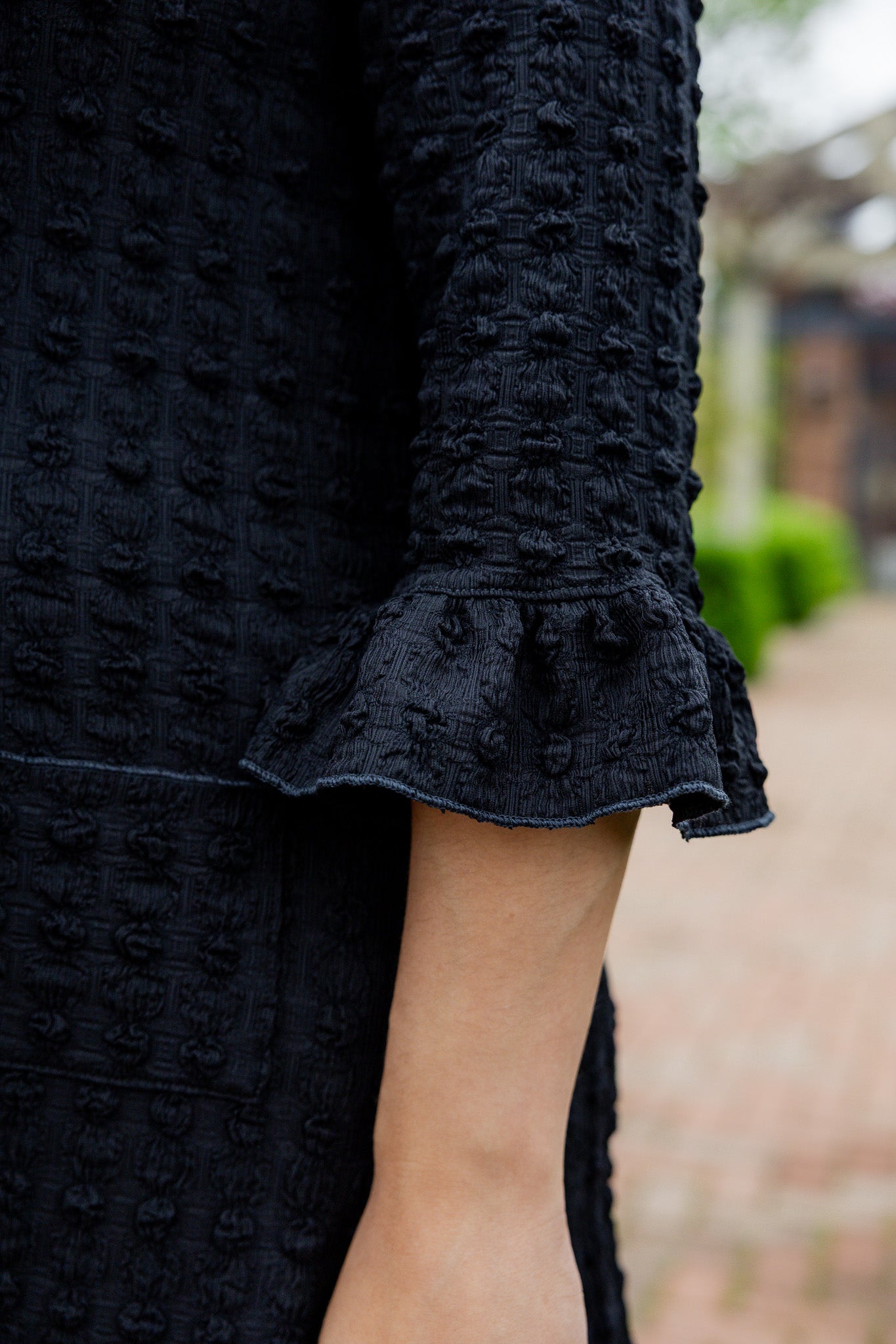 Mommy and Me matching dresses – Model in textured Daphne Dress.