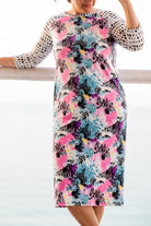 Model wearing Nuggles® Sport Swim Dress in Watercolor Blossom