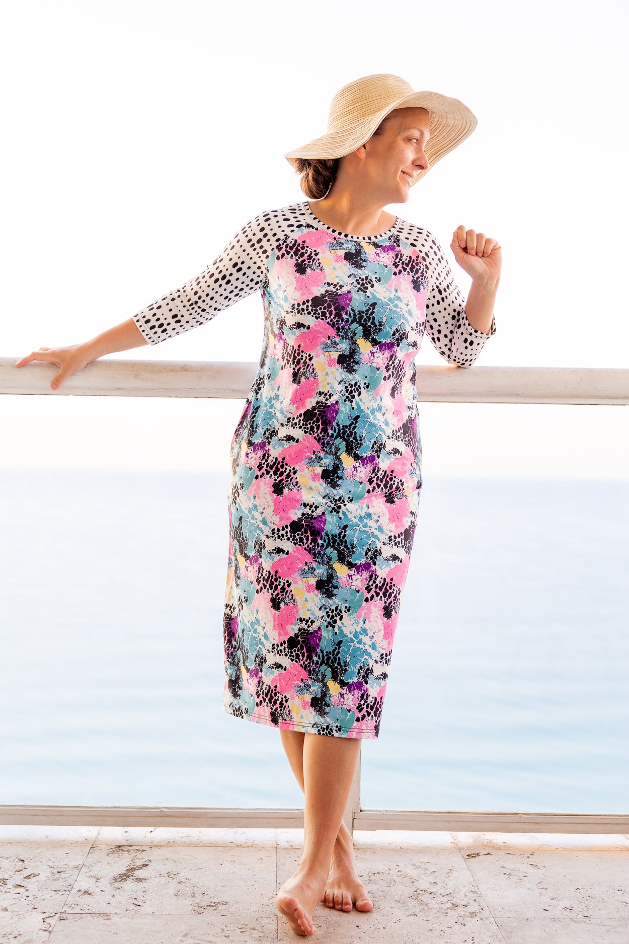 Model wearing Nuggles® Sport Swim Dress in Watercolor Blossom