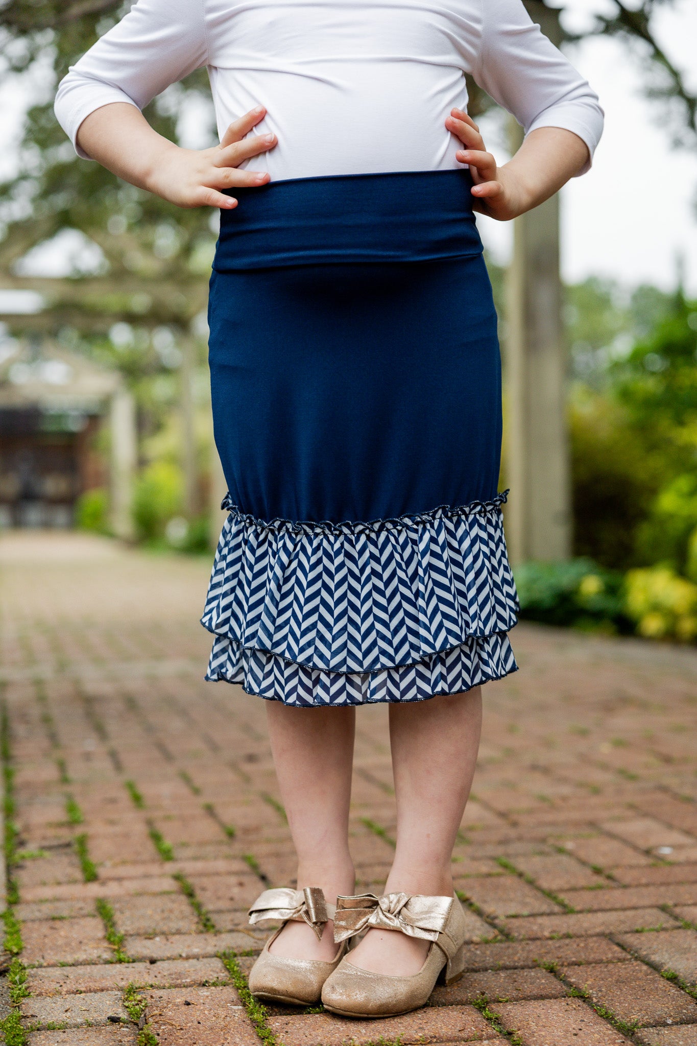 Modest girls’ ruffle slip with wide no-elastic waistband, perfect for layering under dresses and skirts.