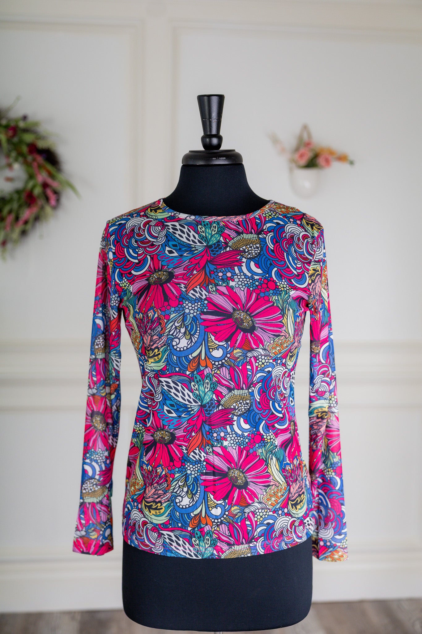 Girl wearing long sleeve mesh layering top by Nuggles® in breathable stretch fabric.