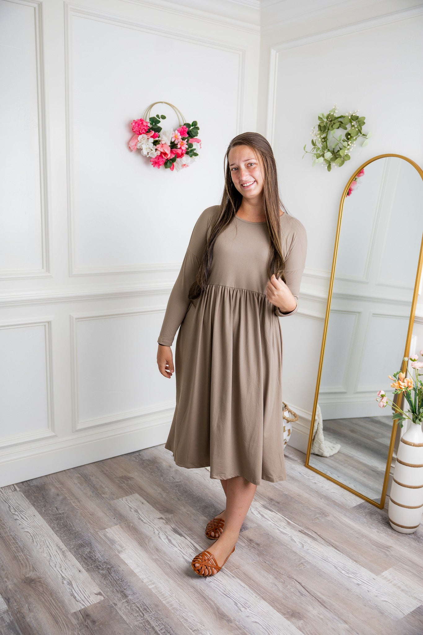 Nuggles® Farah Dress in solid color, modest long sleeve midi dress with empire waist, styled with flats for everyday wear.