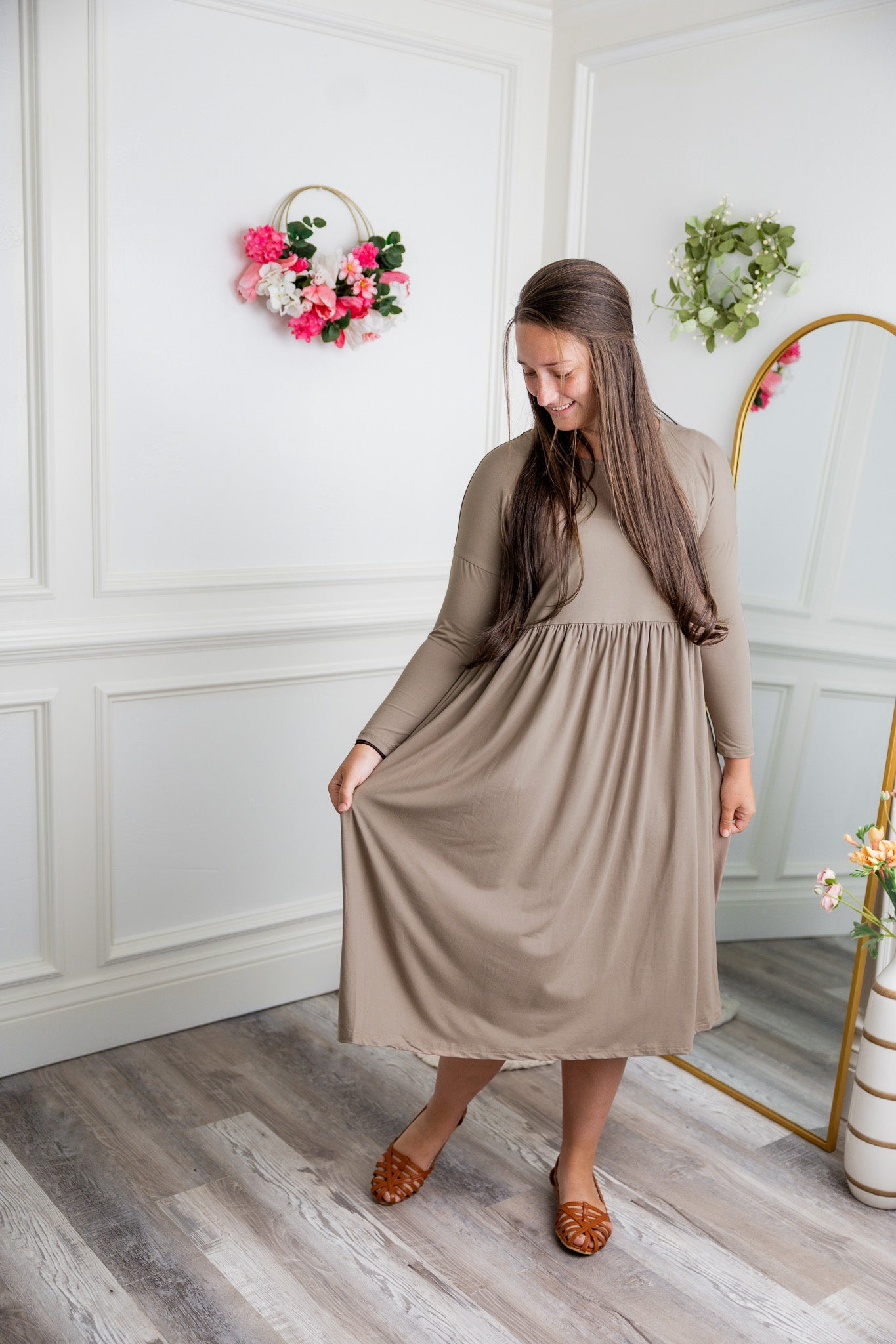 Nuggles® Farah Dress in solid color, modest long sleeve midi dress with empire waist, styled with flats for everyday wear.