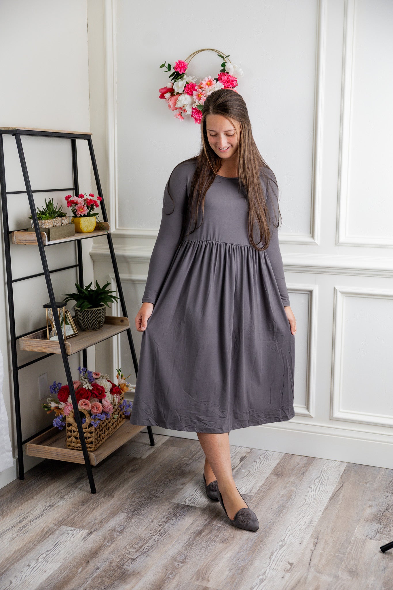 Nuggles® Farah Dress in solid color, modest long sleeve midi dress with empire waist, styled with flats for everyday wear.