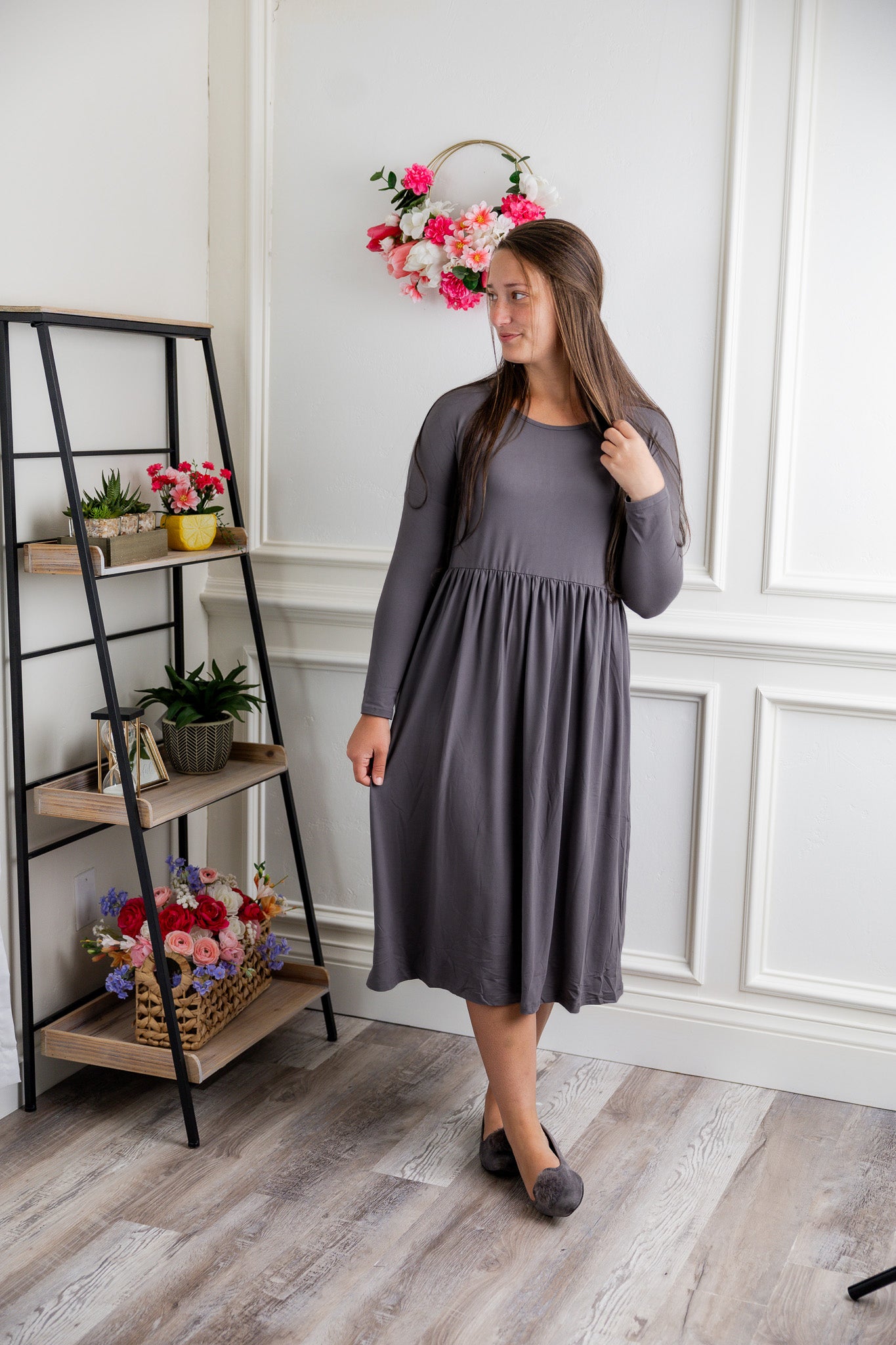 Nuggles® Farah Dress in solid color, modest long sleeve midi dress with empire waist, styled with flats for everyday wear.