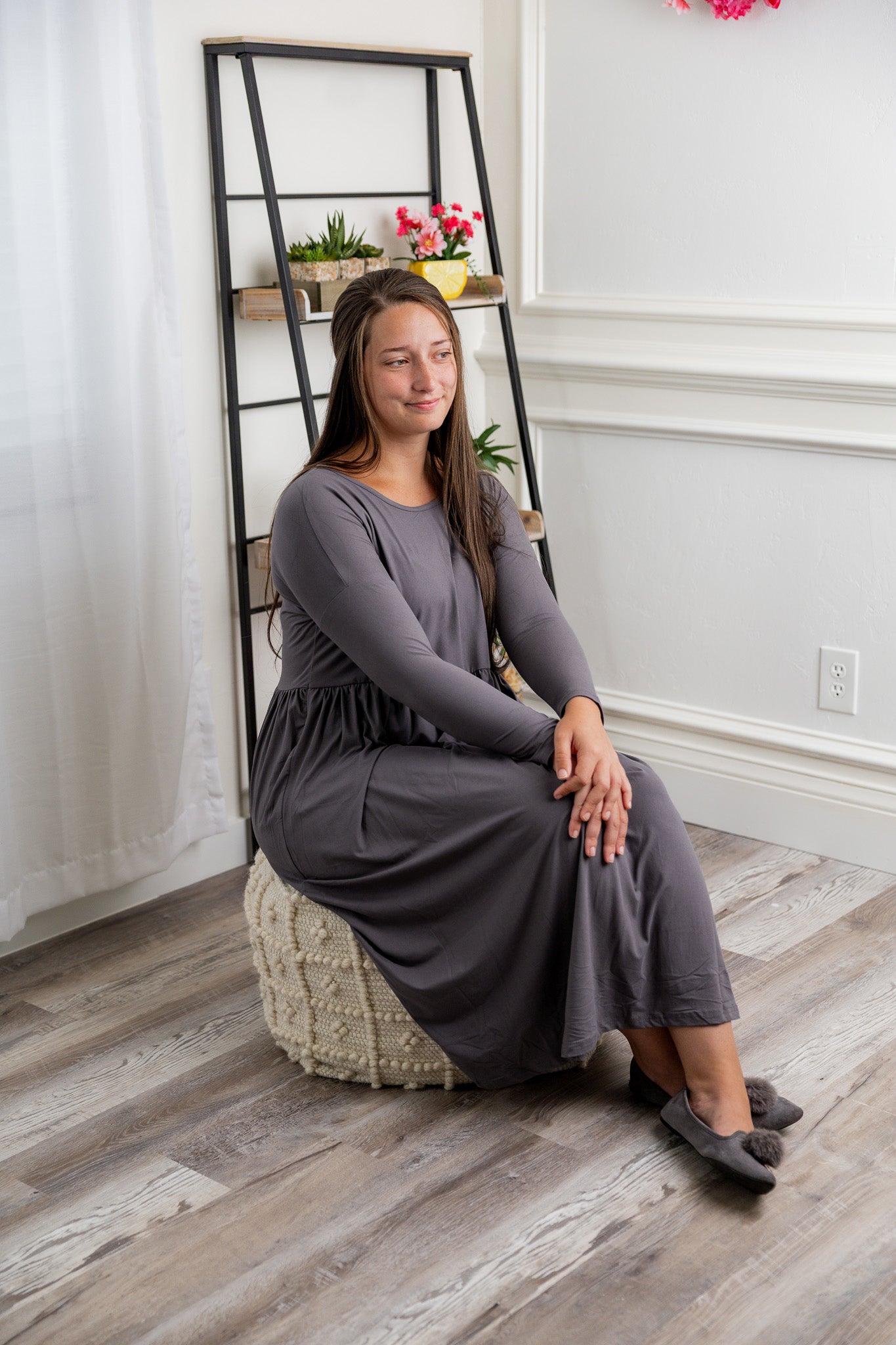 Nuggles® Farah Dress in solid color, modest long sleeve midi dress with empire waist, styled with flats for everyday wear.