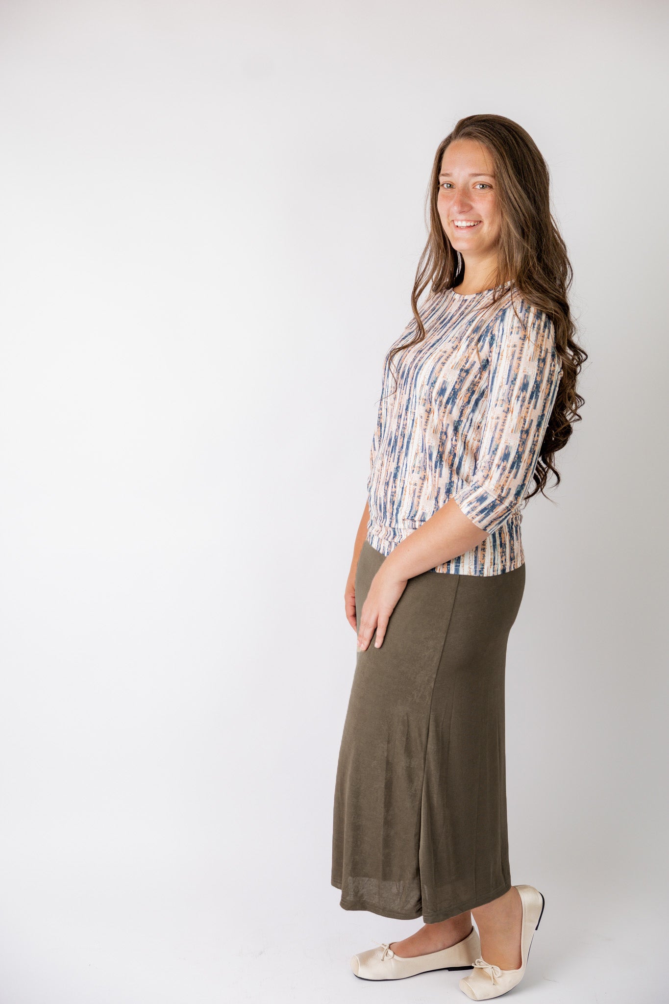 Nuggles® Renee Slinky Skirt – modest midi skirt in soft slinky stretch fabric, styled for everyday and dressy wear.