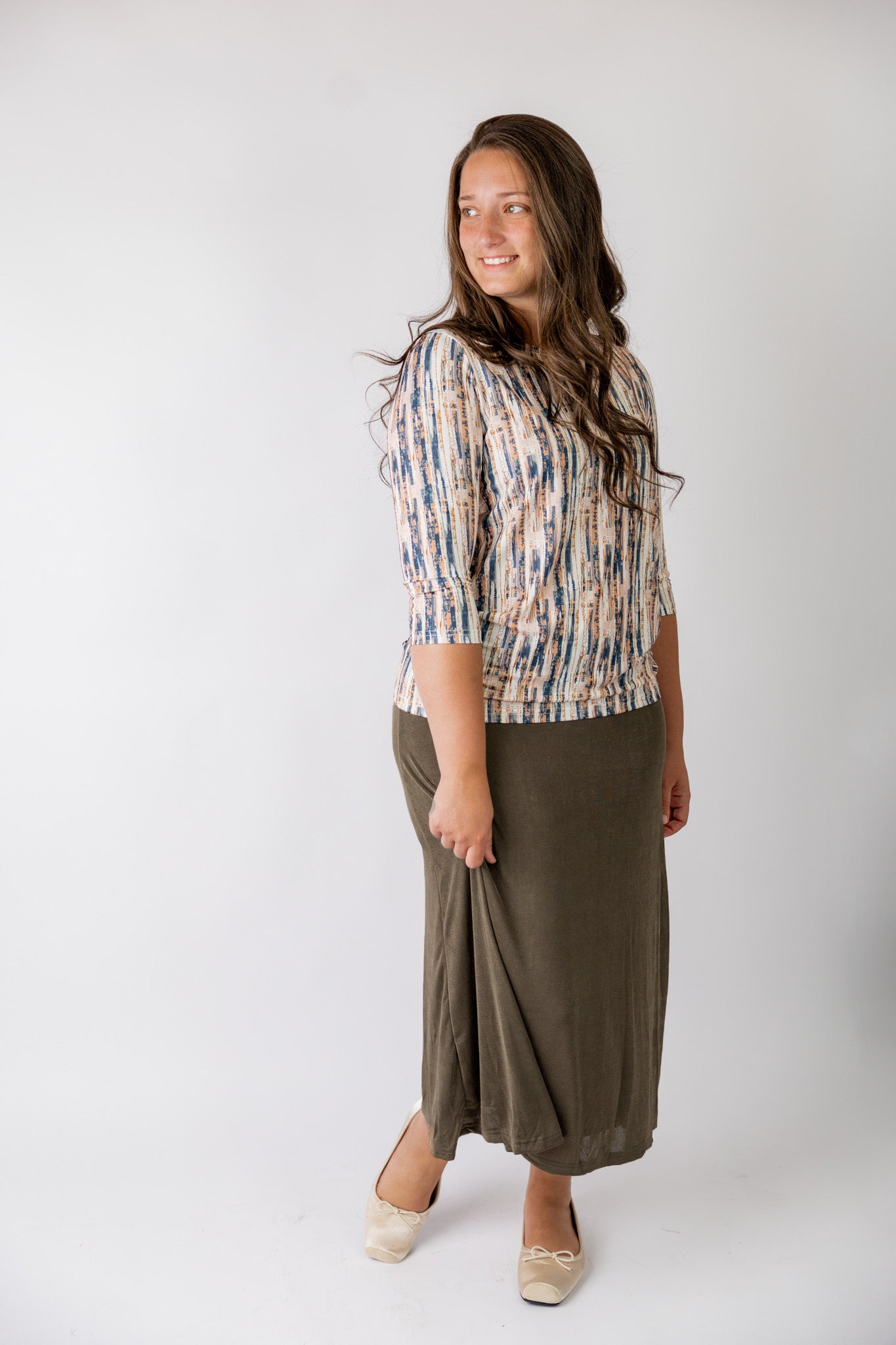 Nuggles® Renee Slinky Skirt – modest midi skirt in soft slinky stretch fabric, styled for everyday and dressy wear.