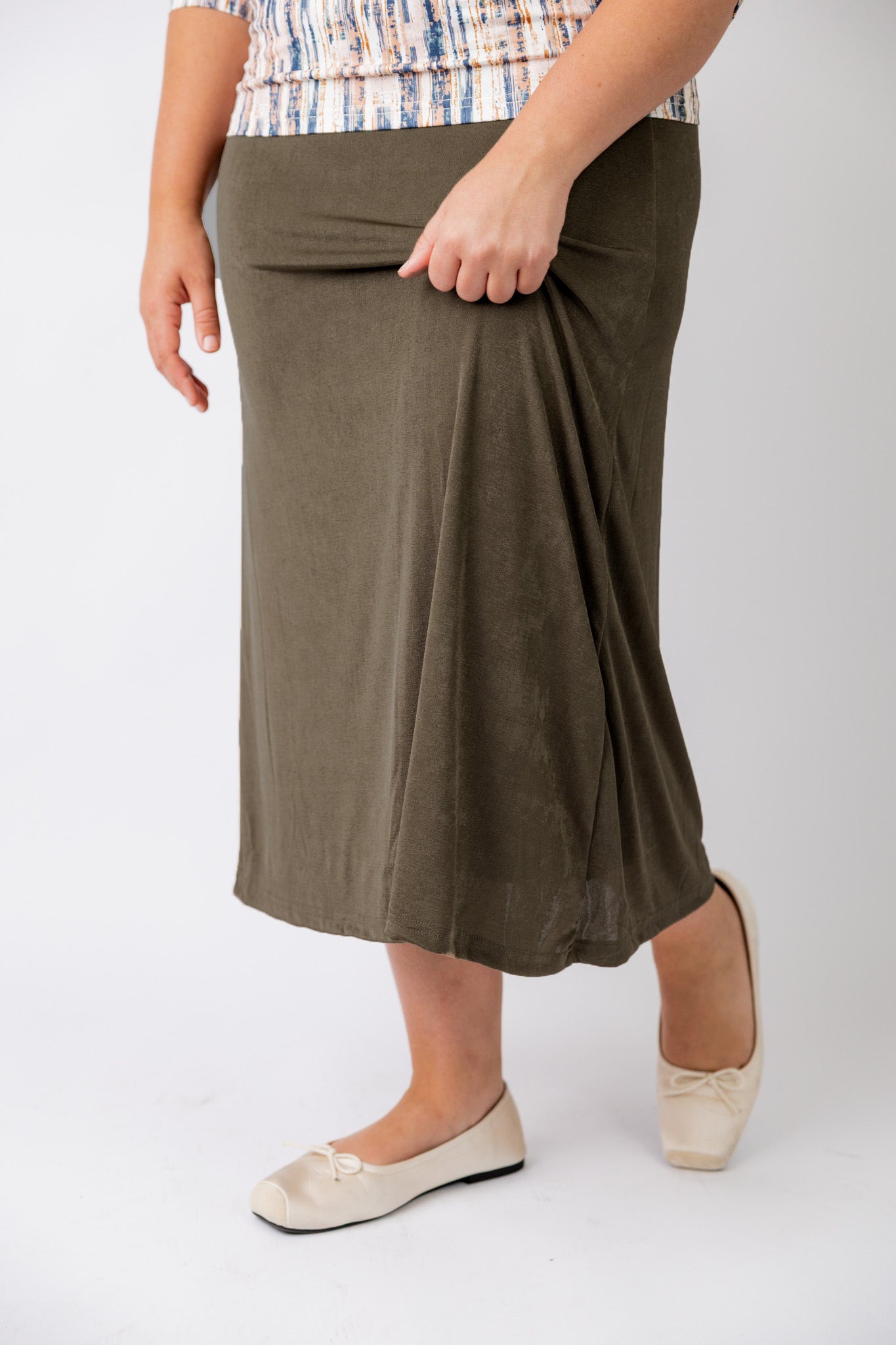 Nuggles® Renee Slinky Skirt – modest midi skirt in soft slinky stretch fabric, styled for everyday and dressy wear.