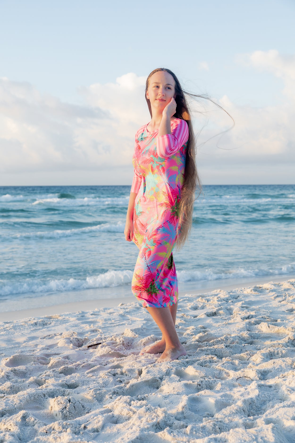 Model wearing Nuggles® Sport Swim Dress in Tropical Daydream