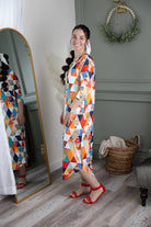 Model wearing Nuggles®  Heather Dress in Triangle Taffy