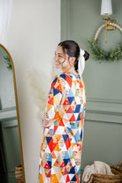 Model wearing Nuggles®  Heather Dress in Triangle Taffy