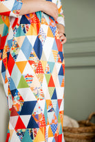 Model wearing Nuggles®  Heather Dress in Triangle Taffy