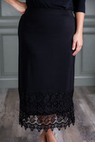 Model wearing Nuggles® lace panel skirt with floral lace hem detail – modest fashion midi skirt.
