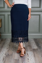 Model wearing Nuggles® lace panel skirt with floral lace hem detail – modest fashion midi skirt.