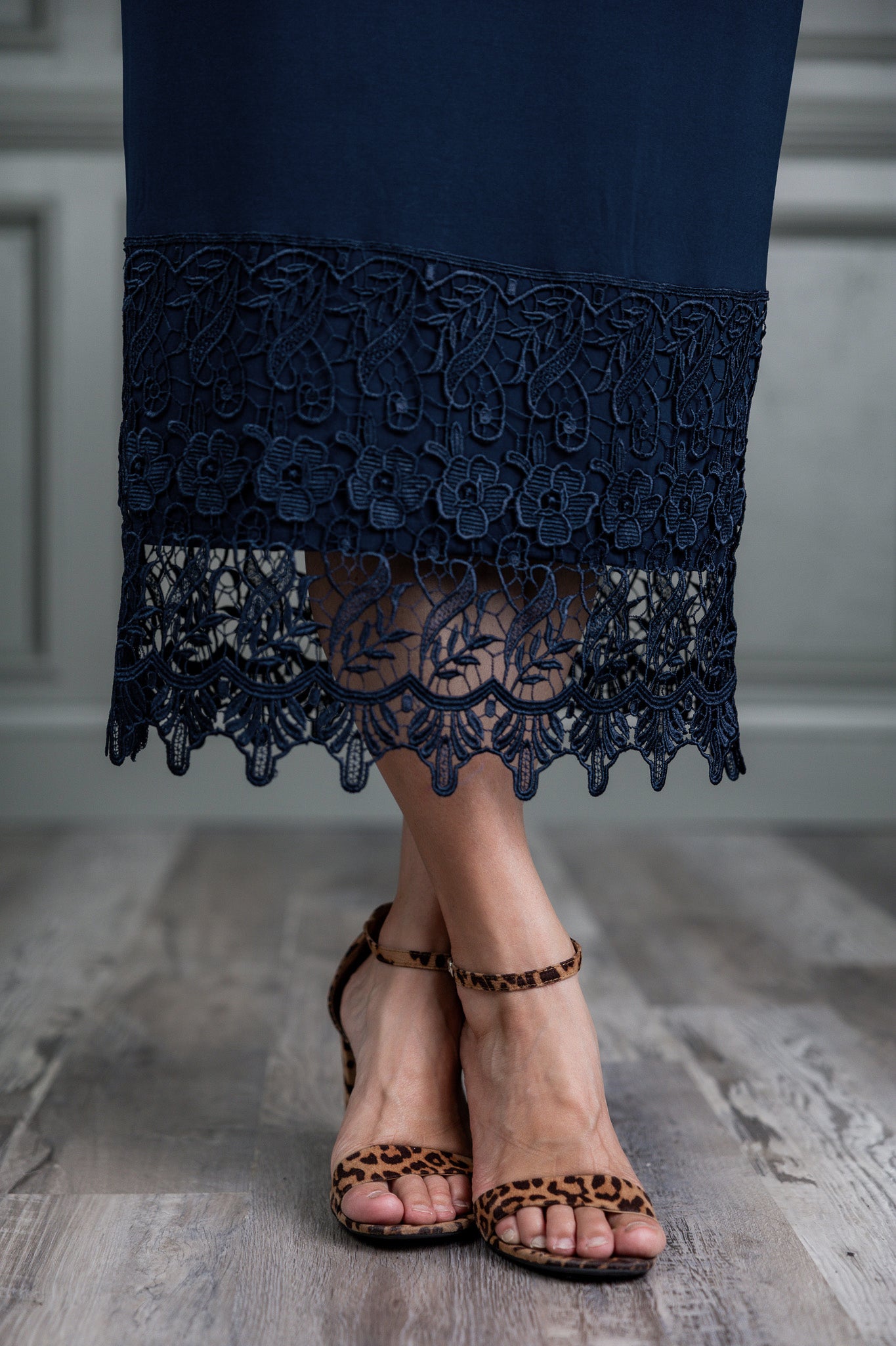 Model wearing Nuggles® lace panel skirt with floral lace hem detail – modest fashion midi skirt.