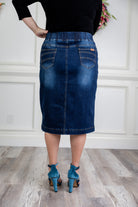 Nuggles denim midi skirt with soft stretch fabric, wide elastic waistband, modest length, and functional pockets. Available in 27", 31", and 34" lengths.