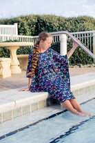 Model wearing Nuggles® Carlie Swim Dress in Nautical Nights
