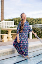 Model wearing Nuggles® Carlie Swim Dress in Nautical Nights