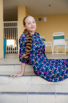 Model wearing Nuggles® Carlie Swim Dress in Nautical Nights