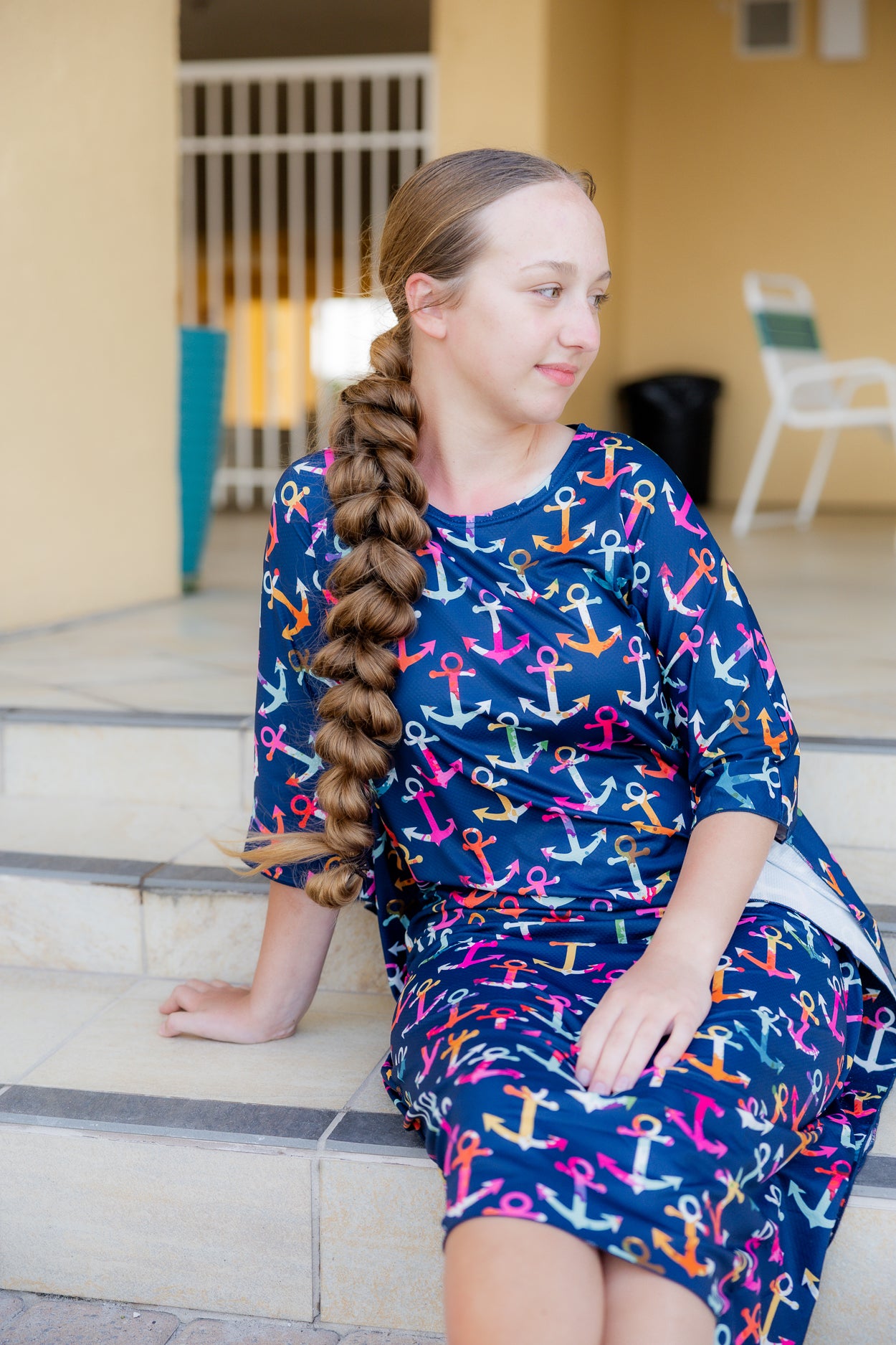 Model wearing Nuggles® Carlie Swim Dress in Nautical Nights