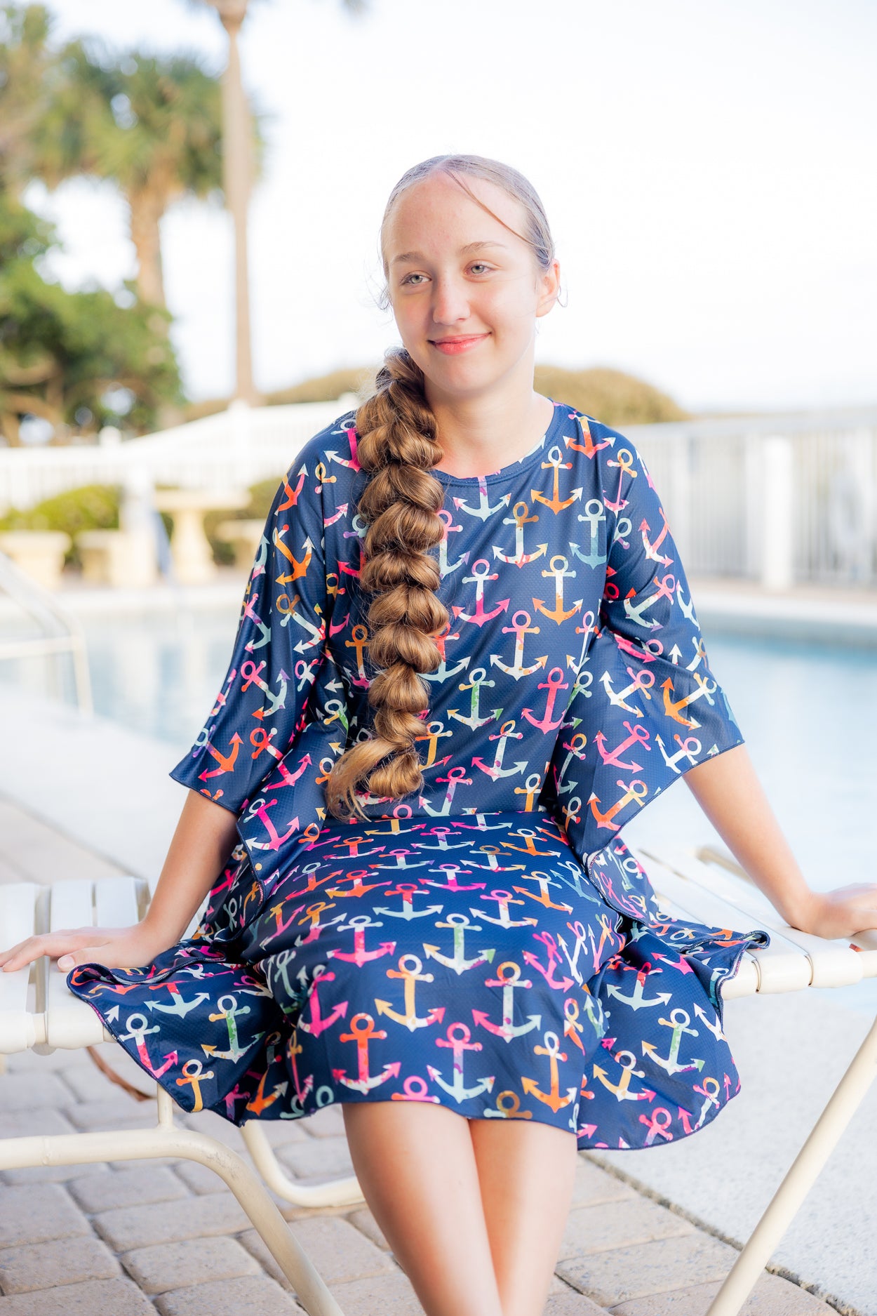 Model wearing Nuggles® Carlie Swim Dress in Nautical Nights