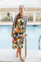 Model wearing Nuggles® Sport Swim Dress in Painted Patchwork
