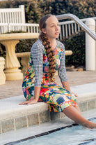 Model wearing Nuggles® Sport Swim Dress in Painted Patchwork