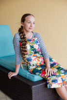 Model wearing Nuggles® Sport Swim Dress in Painted Patchwork