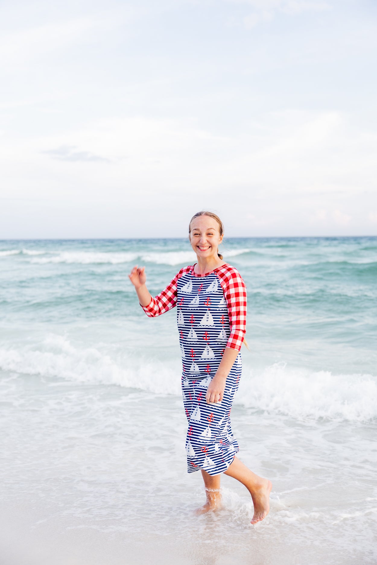 Model wearing Nuggles® Sport Swim Dress in Happy Campers