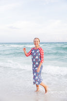 Model wearing Nuggles® Sport Swim Dress in Happy Campers