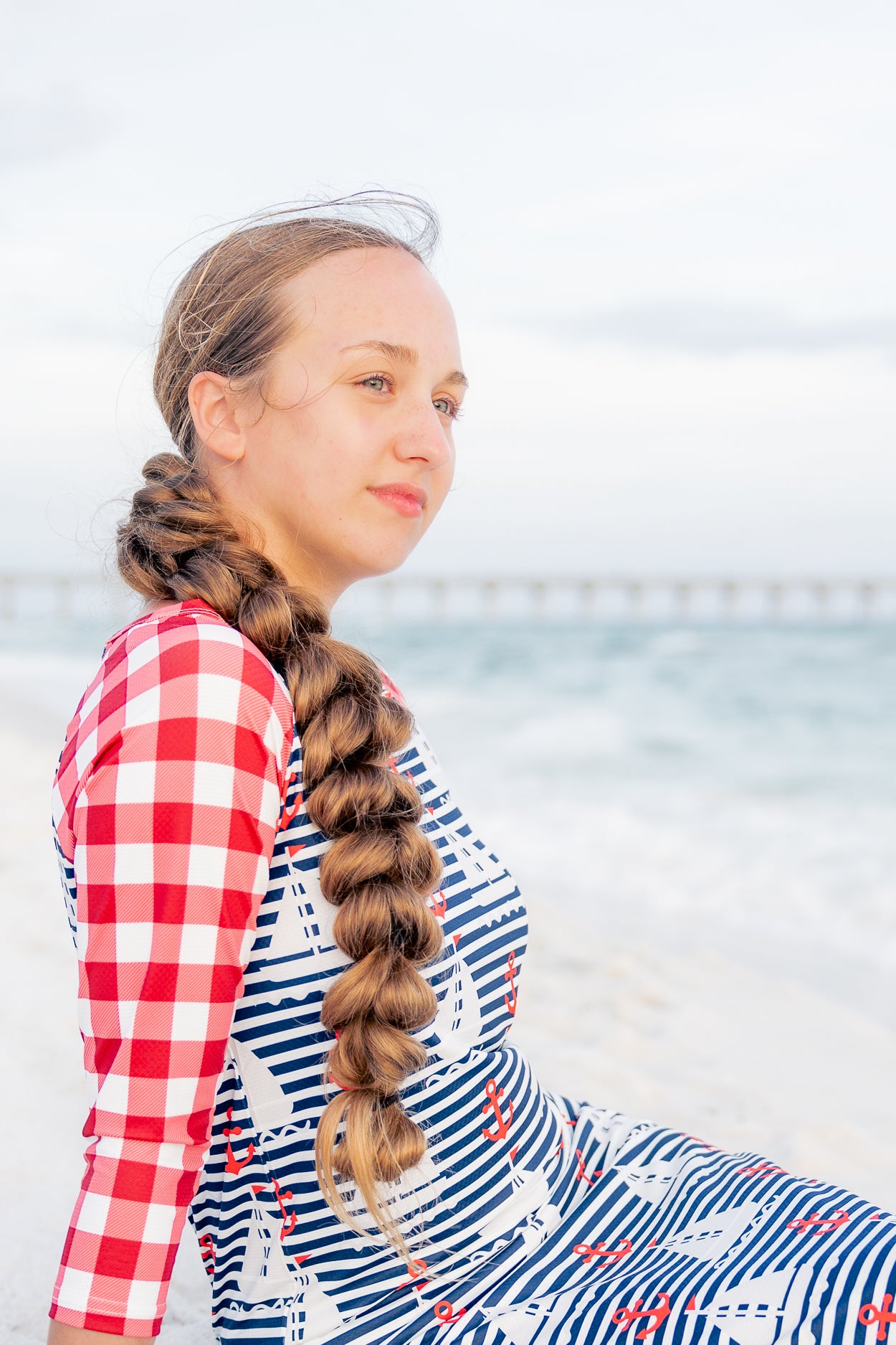 Model wearing Nuggles® Sport Swim Dress in Happy Campers