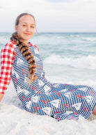 Model wearing Nuggles® Sport Swim Dress in Happy Campers