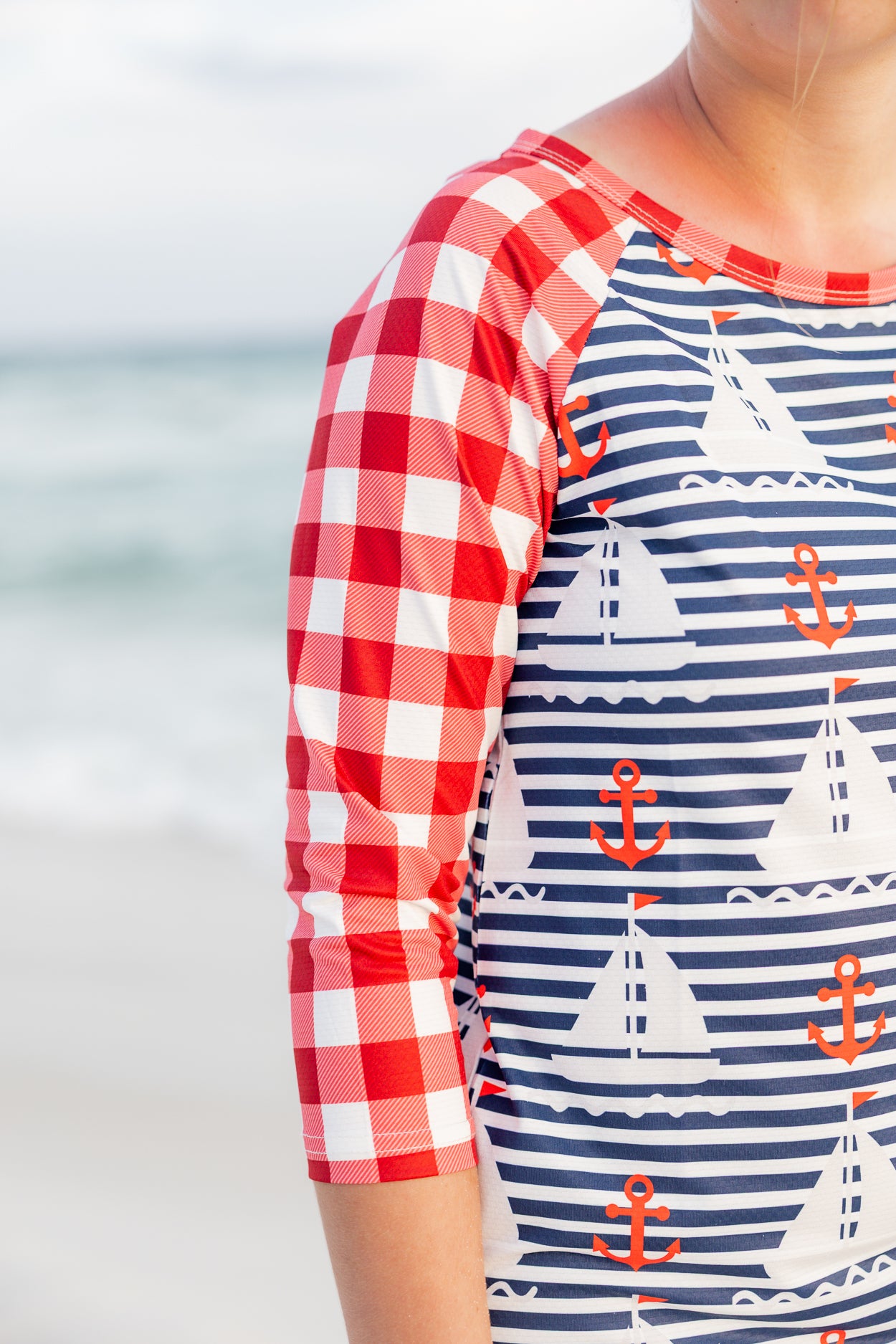Model wearing Nuggles® Sport Swim Dress in Happy Campers