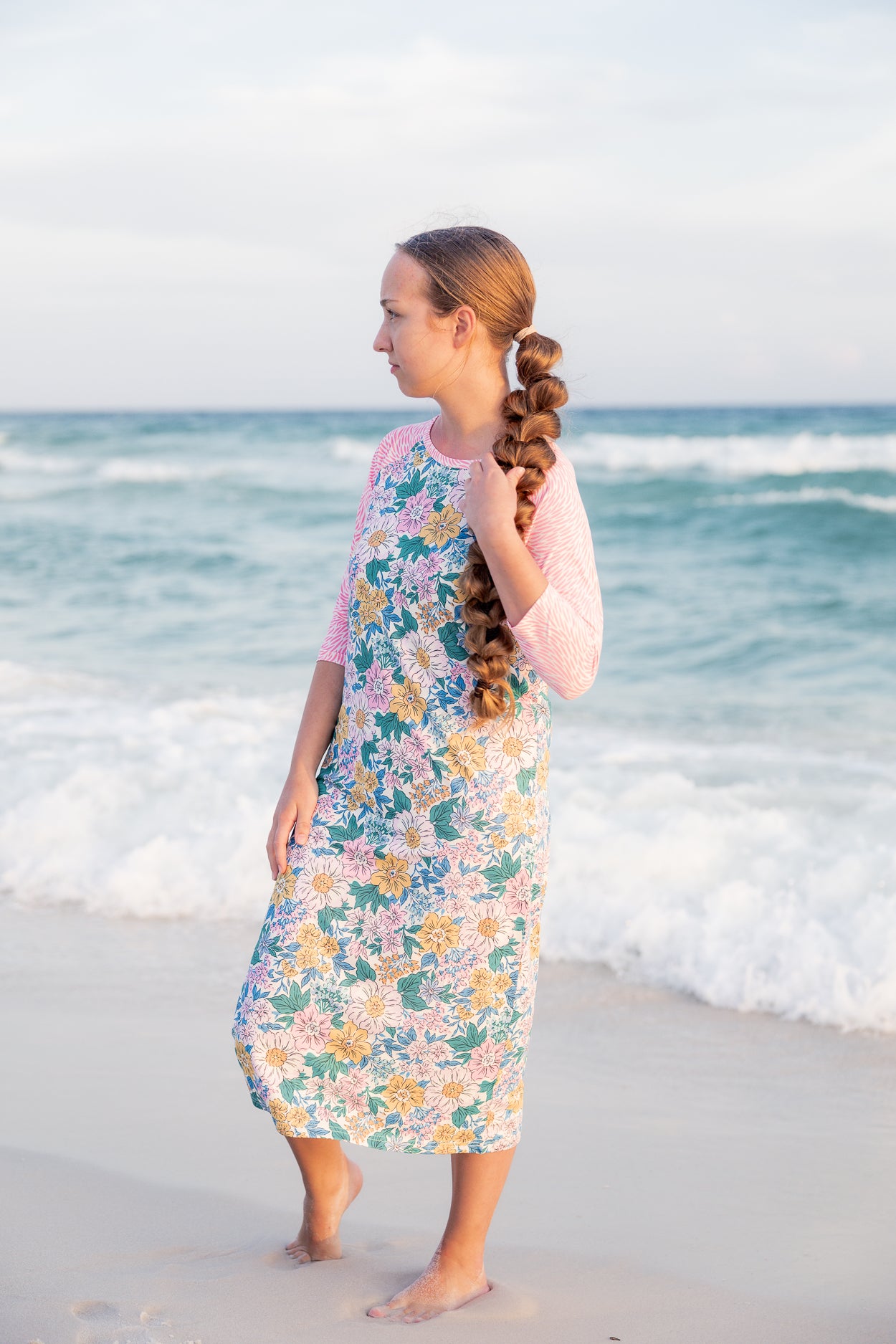 Model wearing Nuggles® Sport Swim Dress in Daisy Daydream