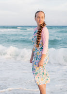 Model wearing Nuggles® Sport Swim Dress in Daisy Daydream