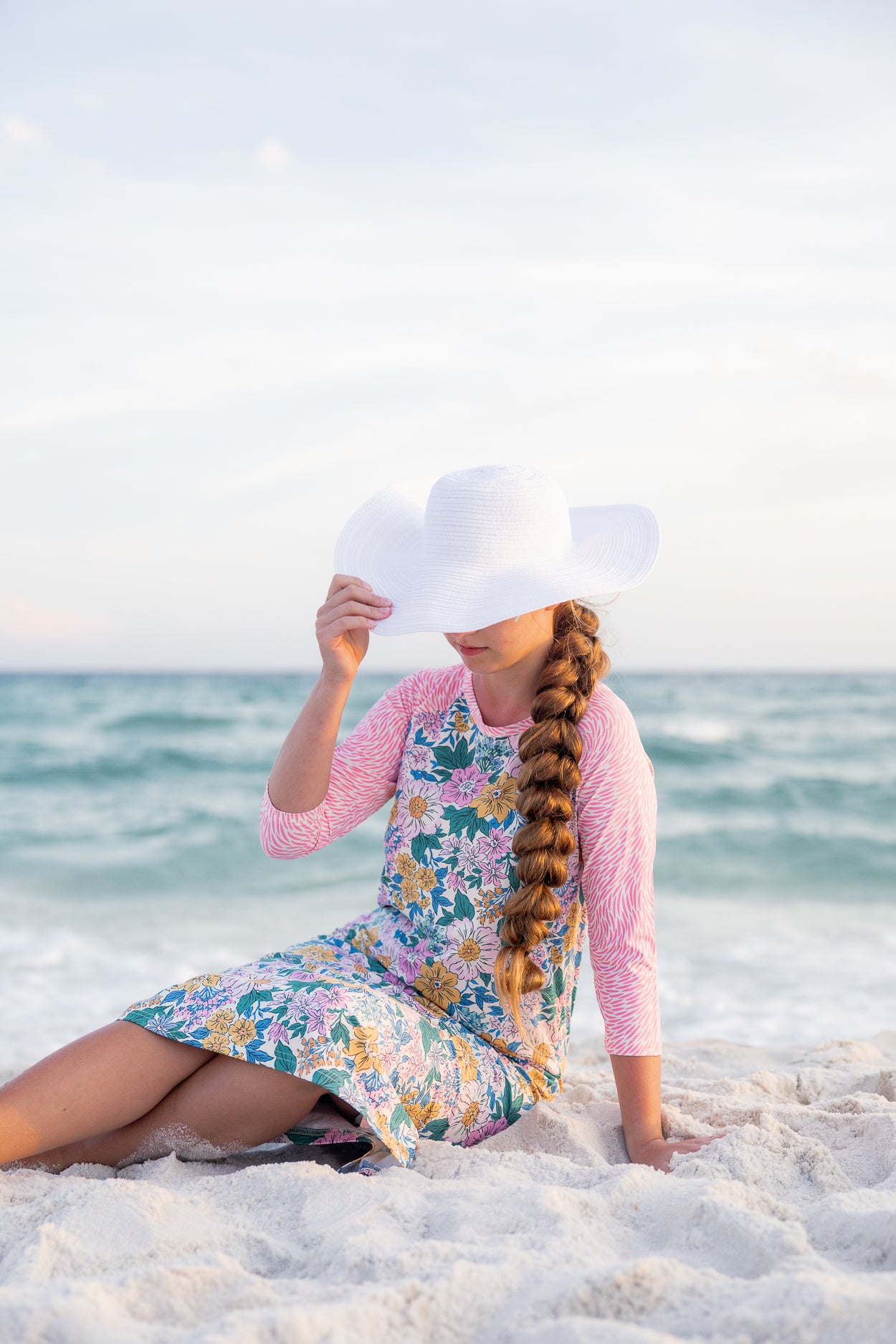 Model wearing Nuggles® Sport Swim Dress in Daisy Daydream