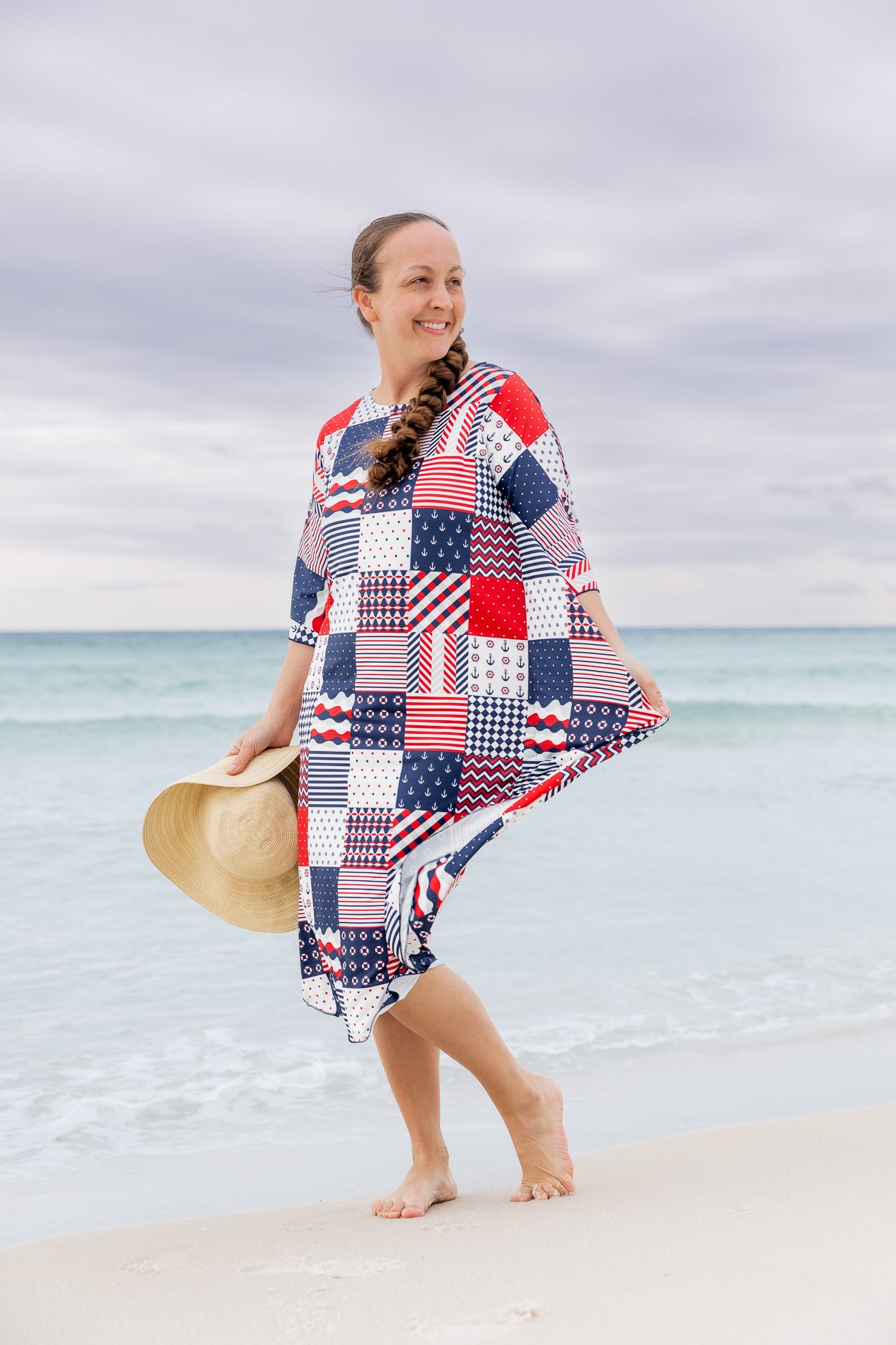 Model wearing Nuggles® Carlie Swim Dress in Boardwalk Patch