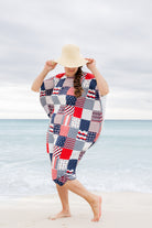 Model wearing Nuggles® Carlie Swim Dress in Boardwalk Patch