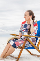 Model wearing Nuggles® Carlie Swim Dress in Boardwalk Patch