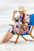 Model wearing Nuggles® Carlie Swim Dress in Boardwalk Patch