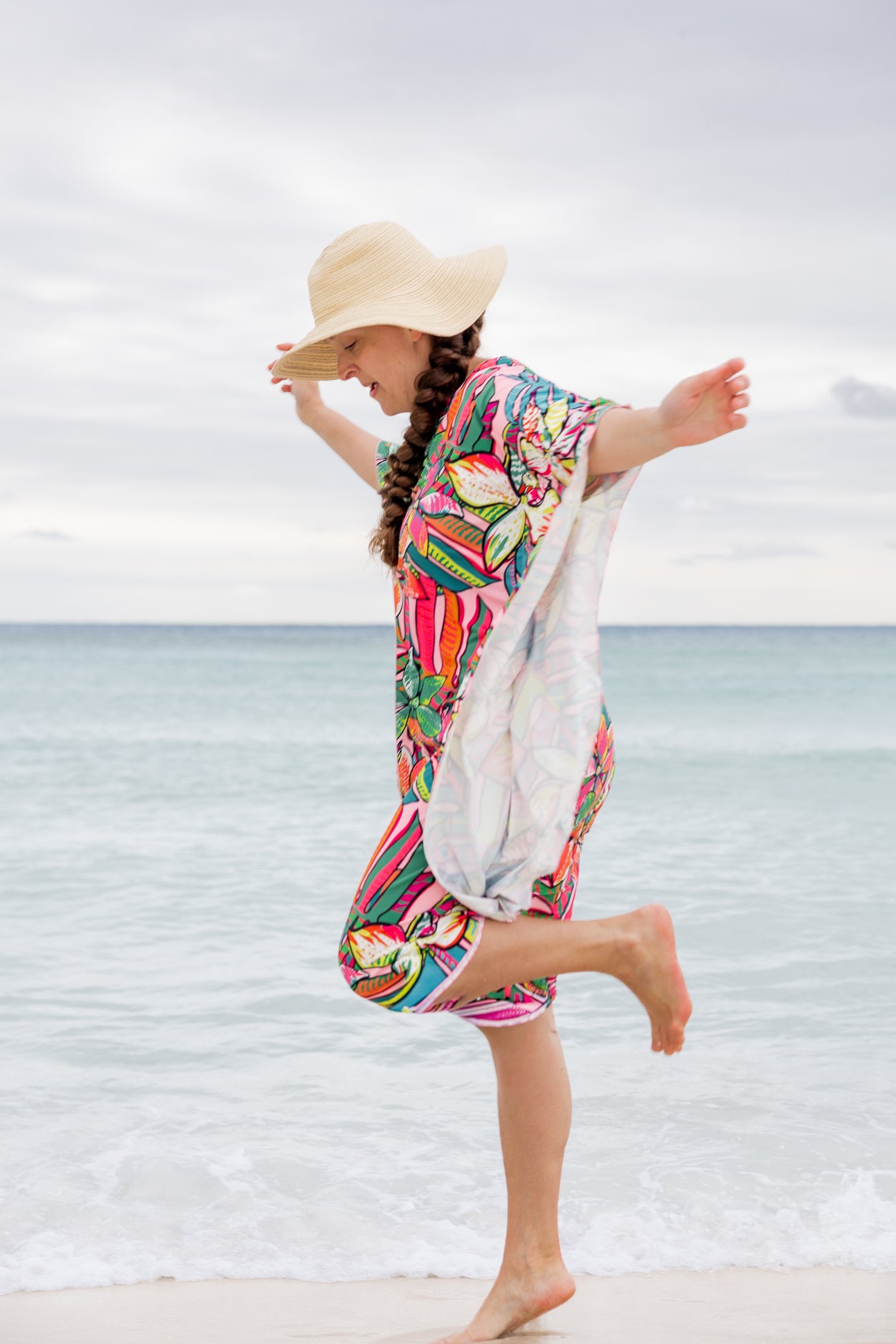 Model wearing Nuggles® Carlie Swim Dress in Aloha Bloom