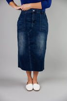Nuggles® denim midi skirt with soft stretch fabric, wide elastic waistband, modest length, and functional pockets. Available in 27", 31", and 34" lengths.