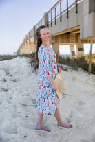 Model wearing Nuggles® Nola Sport Swim Dress in Harbor Sailboats 