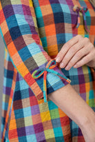Model wearing Nuggles® Lexi Bow Top in Jackson Plaid