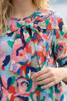 Nuggles Eleanor Top in Jelly Pop, modest A-line top in bright pink pattern, maternity-friendly fit