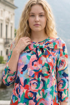 Nuggles Eleanor Top in Jelly Pop, cheerful pink patterned modest top with signature bow neckline