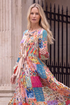 Model wearing Nuggles®  Addison Dress in Keepsake Quilt