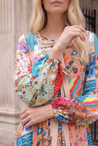 Model wearing Nuggles®  Addison Dress in Keepsake Quilt